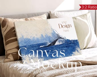 May include: Canvas mockup featuring a whale breaching the ocean, with blue and white watercolor-style artwork. The canvas is propped up on a bed with pillows and a blanket. Text on the canvas reads "Your Design Here" and "Canvas Mockup".