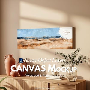 May include: A canvas mockup featuring a desert landscape painting with blue skies and tan dunes. The canvas is rectangular and mounted on a wall. The text "Your Design Here" is visible. The words "CANVAS Mockup" are also visible.