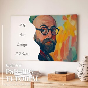 Puede incluir: Una impresi&oacute;n en lienzo con un retrato de un hombre con gafas y barba, con pinceladas coloridas. El texto "Add Your Design 3:2 Ratio" est&aacute; a la izquierda. La imagen es parte de una maqueta con un tutorial.