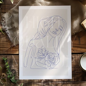 May include: A line drawing of a woman with long hair, holding a flower in her hand. The drawing is in blue on a beige background.
