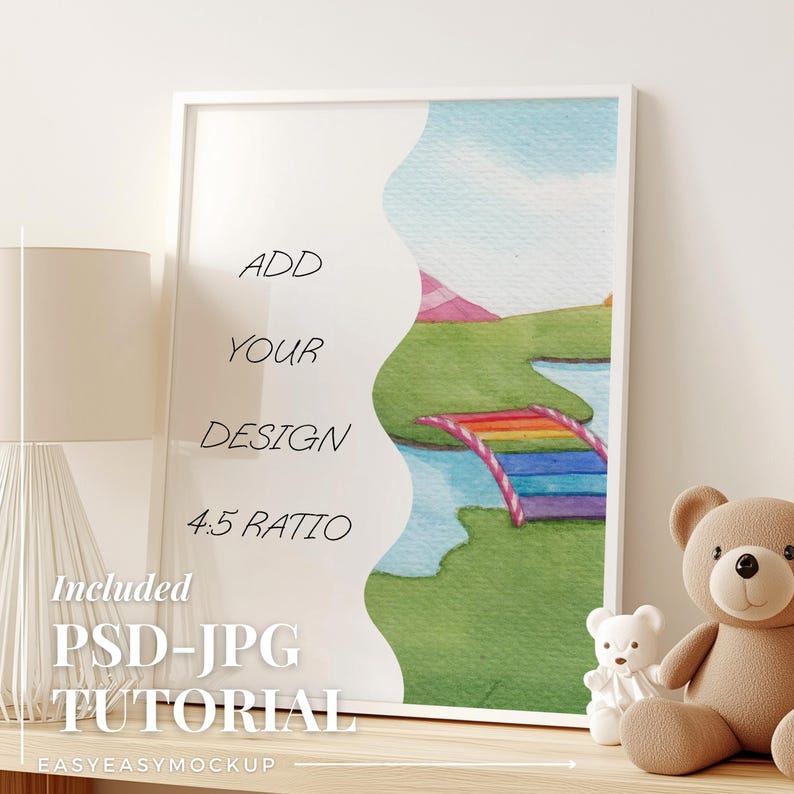 May include: A white frame with a watercolor painting of a rainbow bridge over a river in a green field. The text "ADD YOUR DESIGN 4:5 RATIO" is on the left side of the frame. The frame is on a wooden surface with a white lamp and two teddy bears.
