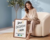 Woman Holding Frame Mockup 5:7 With Thin Wood Border, Boucle & Cashmere Lifestyle, Sunlit Warm Room, Elegant Interior Art Print Display, PSD