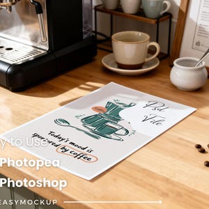 May include: A coffee-themed mockup scene featuring a white paper with a coffee pot illustration and the text "Today's mood is sponsored by coffee." The scene includes a coffee maker, coffee beans, and a coffee cup.