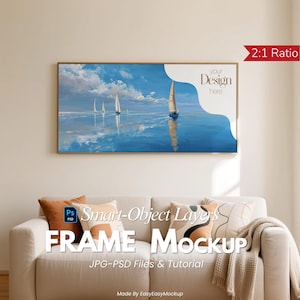 May include: A framed artwork mockup featuring a seascape painting with sailboats on a blue ocean under a cloudy sky. The frame is rectangular with a gold finish. The text "your Design here" is visible. The mockup is displayed above a white sofa with decorative pillows.