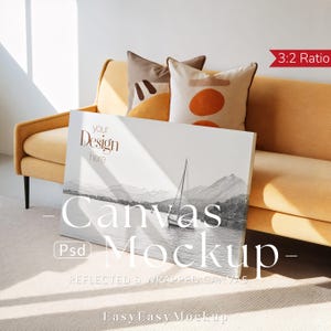 May include: A canvas mockup with a sailboat scene, leaning against a yellow sofa with decorative pillows. The canvas displays the text "Your Design Here" and "Canvas Mockup". The image is a 3:2 ratio, with the text "Reflected & Wrapped Canvas" and "EasyEasy Mockup".