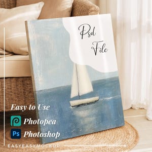 May include: A canvas print featuring a sailboat on the sea, painted in shades of blue and white. The text "Psd File" is displayed in elegant script. Additional text reads "Easy to Use" with the Photopea and Photoshop logos, and "EASYEASYMOCKUP".