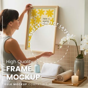 May include: A framed art print with yellow floral designs and the text "THERE IS ALWAYS". The frame is light wood. The image is being held by a person. The words "High Quality FRAME MOCKUP" are also visible.