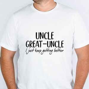 May include: White t-shirt with black text that reads "Uncle Great-Uncle I just keep getting better"