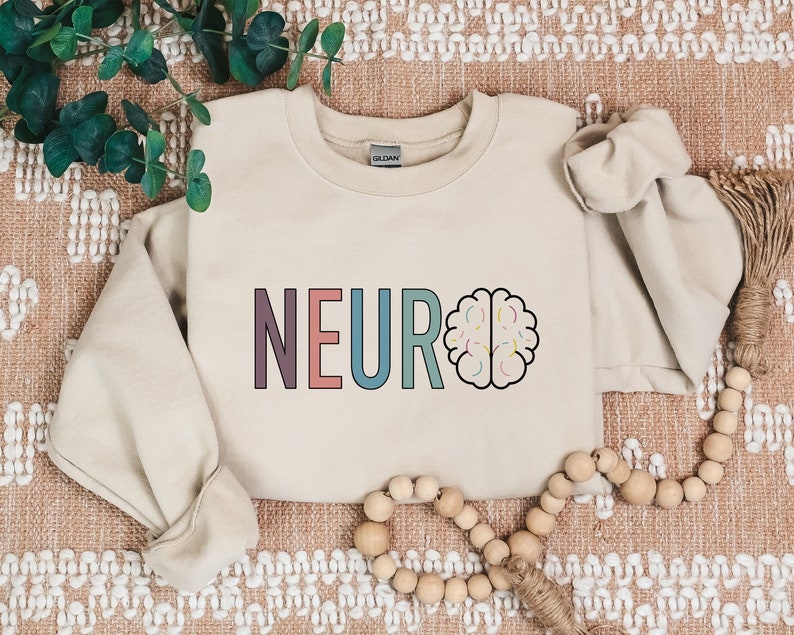a white sweatshirt with the word neuro printed on it