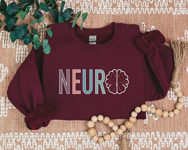 a red sweatshirt with the word neuro on it