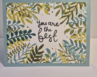Tarjeta de felicitación floral hecha a mano en color verde azulado «Eres el más grande»
