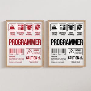 May include: Two red and black warning signs with the word "PROGRAMMER" in large red letters. The signs are framed in wood and have a barcode, a warning symbol, and a list of the composition of a programmer, including hard working, tech skills, sleep, learning skills, wrong answers, caffeine, and funny.