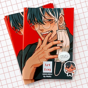 May include: Two art logs with a red cover featuring an anime-style illustration of a person with glasses and black nail polish. The text "Art Log 2022-2024 By Maito" is visible. A sticker with the text "I'm sorry I tried to eat your flesh, I just think you're cute" is also present.