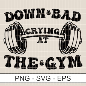 May include: Black and white graphic design with the text "Down Bad Crying At The Gym" with a barbell and weights.