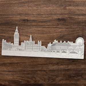 K&ouml;nnte beinhalten: Eine Schwarzwei&szlig;-Zeichnung der Londoner Skyline mit Big Ben, dem Houses of Parliament und dem London Eye.