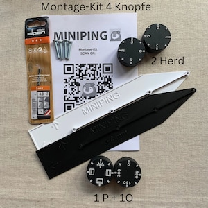 May include: A kit with black and white components, including two black dials with white numbers, two white and black guides, and a drill bit package. The text "MINIPING" is visible on the guides and the packaging. The kit also includes screws.