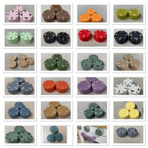 May include: A collection of colorful, round knobs with white numbers indicating settings. The knobs are in various colors, including pink, brown, orange, green, black, red, tan, gray, purple, blue, and yellow. The knobs are likely for appliances or equipment.