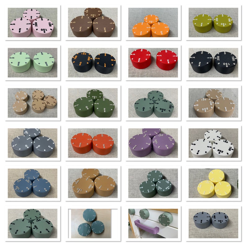 May include: A collection of colorful, round knobs with white numbers indicating settings. The knobs are in various colors, including pink, brown, orange, green, black, red, tan, gray, purple, blue, and yellow. The knobs are likely for appliances or equipment.