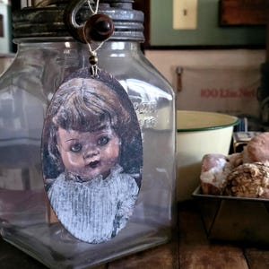 Creepy Doll Ornament – Handmade Gothic Halloween Décor with Photography on Wood