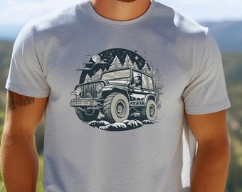 May include: A light grey t-shirt with a graphic of a black jeep driving through a forest at night. The jeep has a moon and stars in the background.