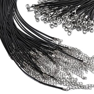 May include: A bulk pack of black leather cord necklaces with silver lobster clasps. The cords are arranged in a fan shape, with the clasps at the top.