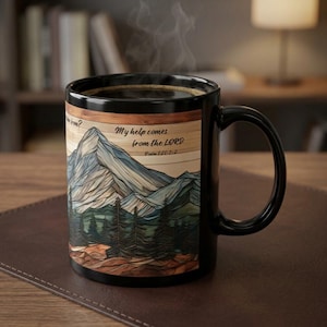 May include: A black ceramic mug featuring a graphic of a mountain range and pine forest with a wood-grain texture background. The text reads, "My help comes from the LORD" and "Psalm 121:1-2". Steam rises from the dark liquid inside the mug.