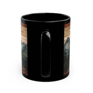 May include: A black ceramic mug featuring a wrap-around graphic design. The illustration depicts a mountain range with pine trees in a wood-grain style frame. The text on the mug reads, I will always love you, in a cursive script font.