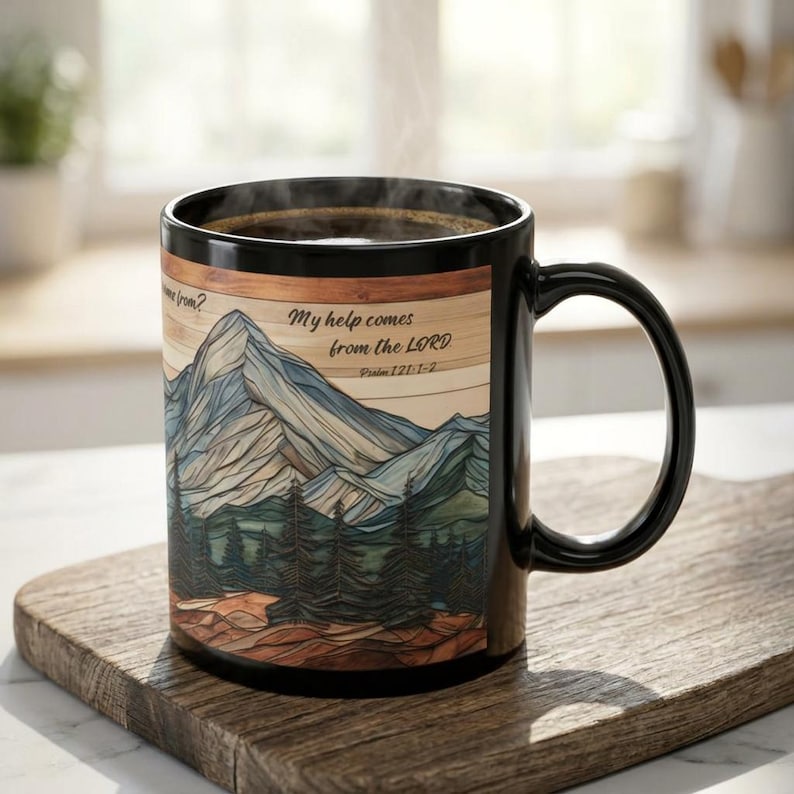 May include: Black coffee mug with a mountain landscape design. The mug features the text "My help comes from the LORD" and Psalm 121:1-2. The design includes blue, green, and brown tones, with a black handle.