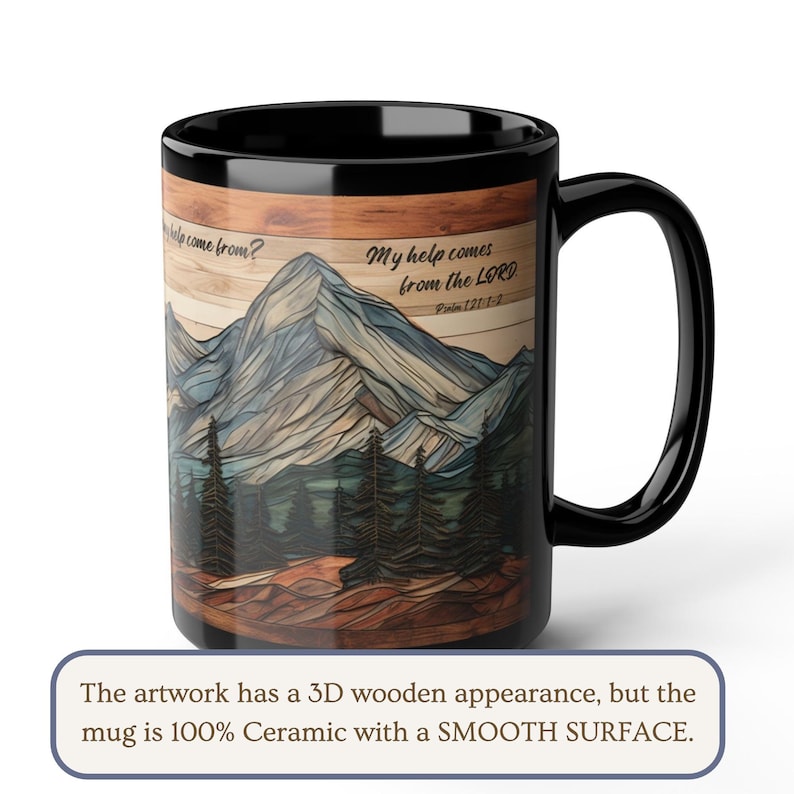 May include: A black ceramic mug featuring a printed graphic of a mountain range and pine forest with a wood-grain texture effect. The text reads: "Where does my help come from? My help comes from the LORD. Psalm 121:1-2." The mug has a smooth surface.