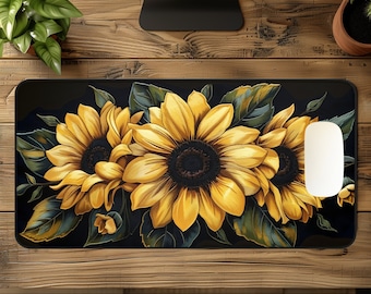 May include: Black mouse pad with a design of three yellow sunflowers with dark centers and green leaves on a black background.