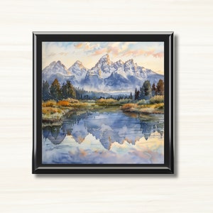 May include: A framed watercolor painting of a mountain range reflected in a still lake. The mountains are snow-capped and the lake is a light blue color. The sky is a light blue with white clouds.