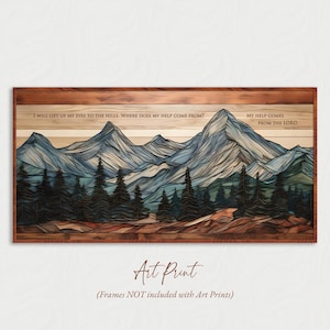 Op de afbeelding: Kunstafdruk met een berglandschap met blauwe en grijze toppen, groene bomen en een bruine houten lijst. De afdruk bevat de tekst "I WILL LIFT UP MY EYES TO THE HILLS. WHERE DOES MY HELP COME FROM?" en "MY HELP COMES FROM THE LORD."