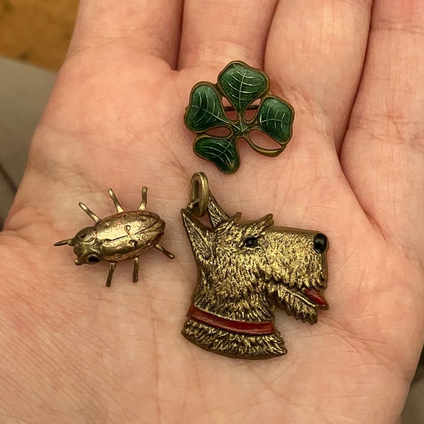 Lot of Three mid century brooches and pendant including enamel four leaf lucky clover/shamrock, scotty dog and ladybird