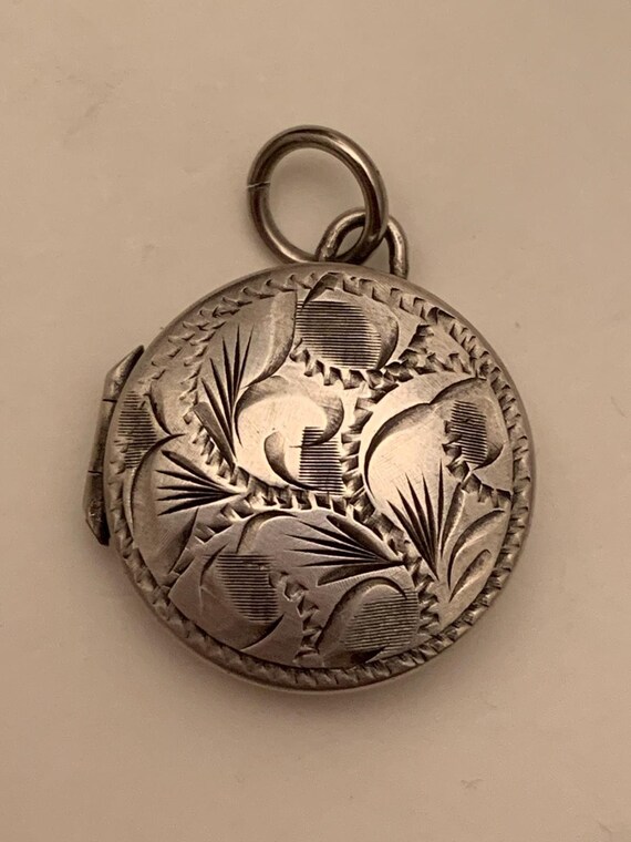 1980s sterling silver etched locket marked JAM Eng