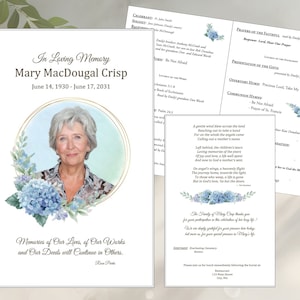 Könnte beinhalten: Eine weiße Gedenkkarte mit goldener Umrandung und einem blauen Aquarell-Blumendesign. Die Karte zeigt ein Foto einer Frau mit grauem Haar und ein Zitat, das lautet "Memories of Our Lives, of Our Works and Our Deeds will Continue in Others." Die Karte enthält auch den Namen Mary MacDougal Crisp und die Daten vom 14. Juni 1930 bis zum 17. Juni 2031.