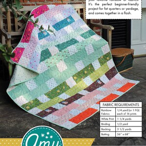 May include: A quilt pattern called "Thread Count" with a colourful patchwork design. The quilt is made with a variety of fabrics in shades of green, blue, pink, and orange. The pattern is for a throw quilt that measures 52 inches by 64 inches. The pattern is by Amy Gibson.