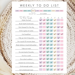 May include: A white weekly to-do list planner sheet with black text and a colorful grid of checkboxes. The header reads WEEKLY TO DO LIST, with the month MAY circled and the week dated 5/1-7/2026. It features rows for daily tasks and columns for days of the week.