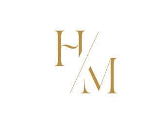 May include: Gold monogram logo with the letters H and M, with a diagonal line intersecting the letters.