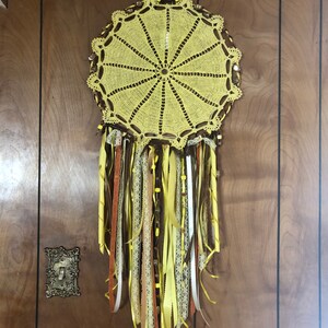 Different styles Dream Catchers that I have done through out the years and two of them I made with hand made Doilies.