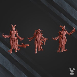 May include: Three reddish-brown fantasy figurines of humanoid creatures with horns, claws, and tails. The figures are in various poses, with one facing forward, one from the back, and one in profile. The background is a dark gray with diagonal lines.