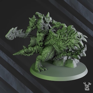May include: A green miniature figure of a fantasy orc warrior riding a reptilian beast. The orc is armored and wielding a jagged blade. The beast has a textured, scaled appearance. The figure is mounted on a round base.