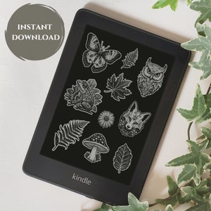 May include: Black and white illustrations of a butterfly, owl, frog, fox, mushroom, fern, and leaves on a black Kindle e-reader.