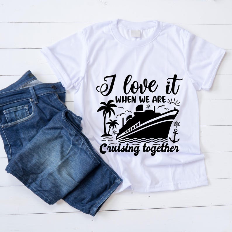 May include: White t-shirt with a black graphic design of a cruise ship, palm trees, and the text "I love it when we are cruising together".