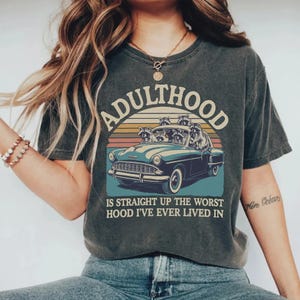 Adulthood is Straight Up the Worst Hood I&#39;ve Lived in, Funny Racoon in a Car, Vintage Animal Saying, Sarcastic Humor T-shirt Cricut Files
