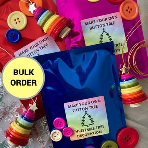 May include: A bulk order of make your own button Christmas tree kits. The kits include colourful buttons, a star, and string to create a unique Christmas tree decoration. The kits are packaged in clear plastic bags with a colourful background.