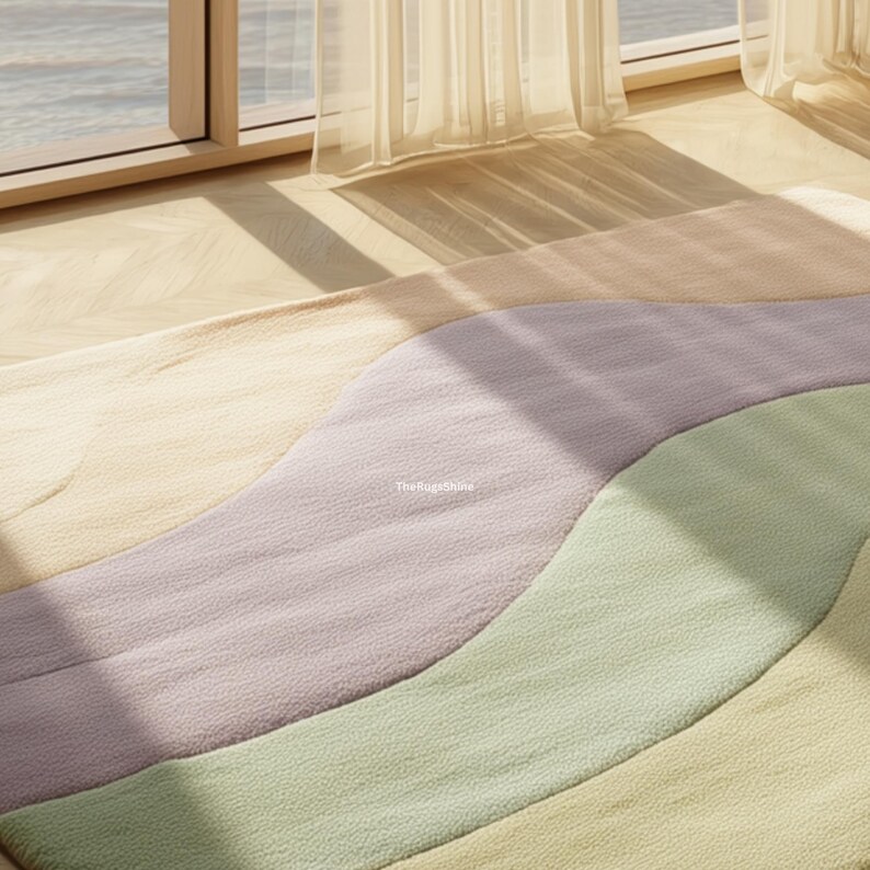 May include: A colorful area rug with a wavy design. The rug features pastel colors including cream, lavender, and green. The rug is made of a soft material and is placed on a wooden floor near a window with sheer curtains.