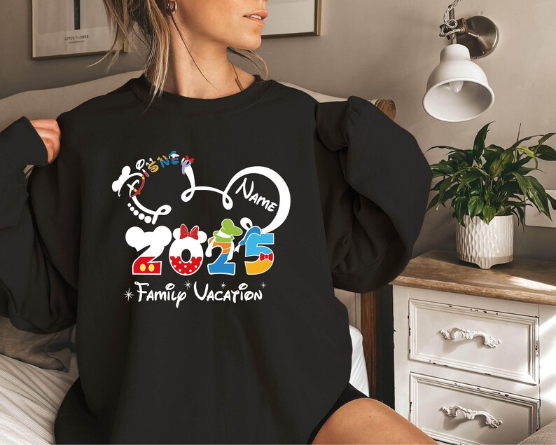 a woman wearing a mickey mouse family vacation shirt
