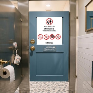 May include: A blue bathroom door with a sign that reads "PLEASE DO NOT FLUSH ANY PRODUCTS OTHER THAN TOILET PAPER." Below the sign is a small plaque that says "HELLO BEAUTIFUL."