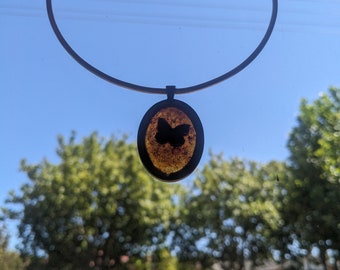 Butterfly silhouette pendant - upcycled from an op shop