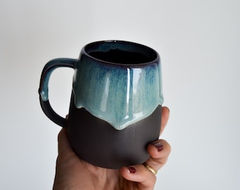 Handmade Stoneware Mug: Black Ceramic Coffee Cup with Blue Drip Glaze